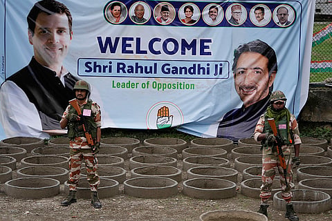 J-K Assembly polls: Indian soldiers guard during an election rally at Dooru